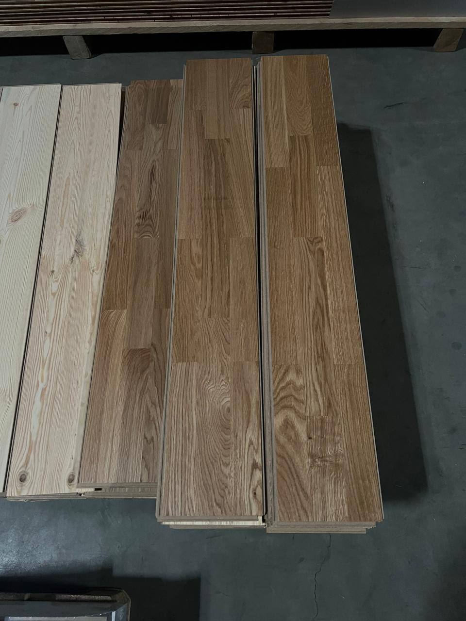 Machined oak and pine boards stacked before packing